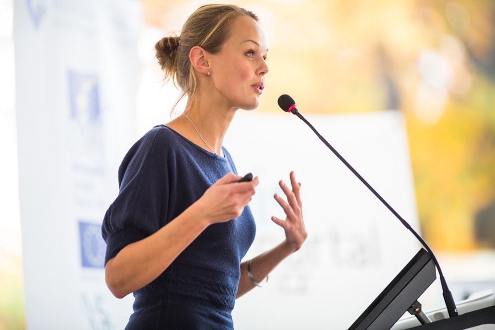 Woman overcoming public speaking nerves